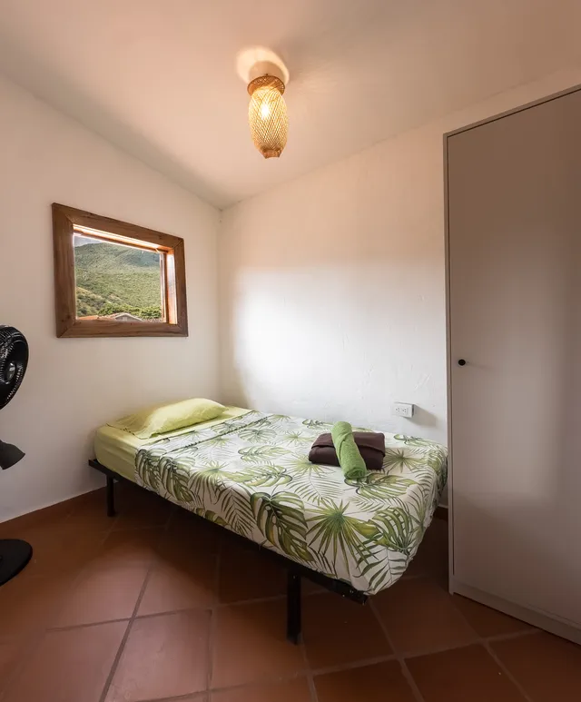 A private room at Donkey Sunrise, with the hills framed in the window