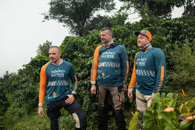 The Donkey Sunrise guides walking a neighbouring coffee farm