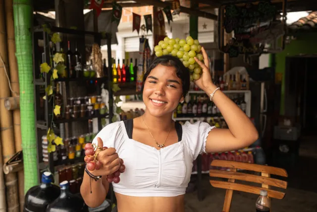 A young woman at a grape and wine shop in La Unión, the grape capital of Colombia