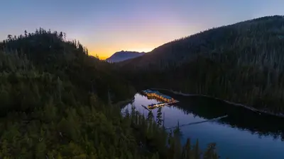 Newton Cove Resort floating in Espinosa Inlet at sunset, Nootka Sound