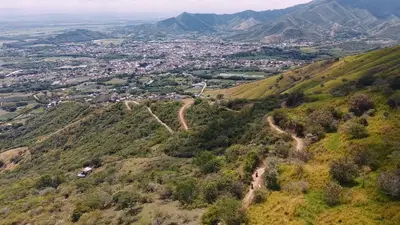 A town spread across the valley floor, from the air
