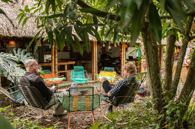 Travellers reading and talking in the open-air lounge at Donkey Sunrise