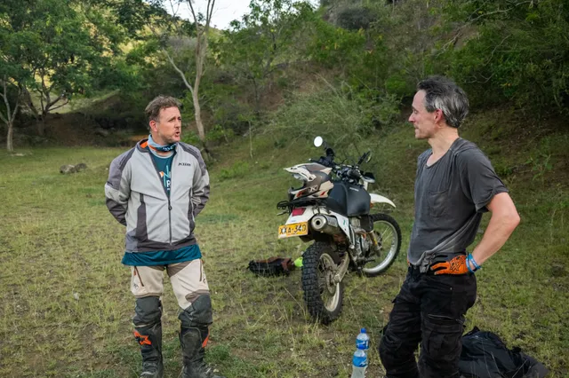 A long-haul traveller talking bikes with a Donkey Sunrise guide