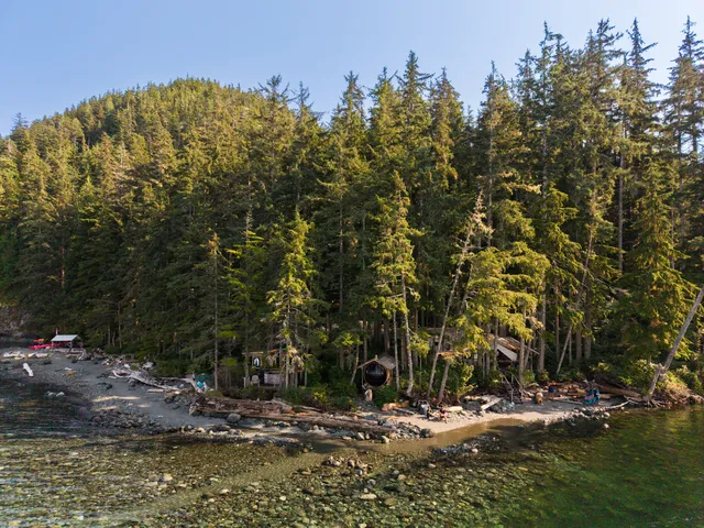 Aerial view of Orca Camp on the forested shoreline of Johnstone Strait