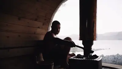 Inside the sauna, looking out through the porthole to the strait