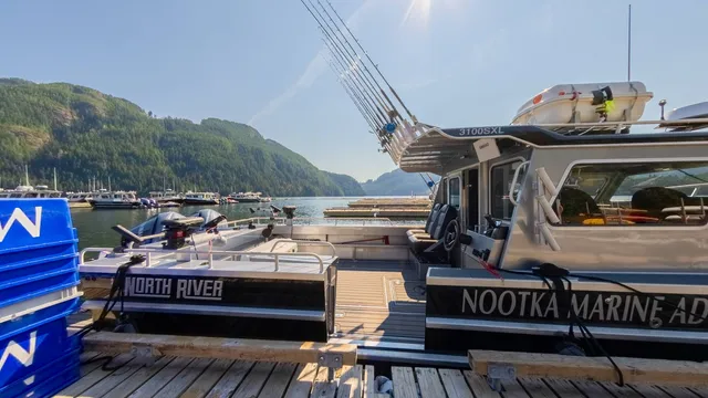 North River guide boats moored at Moutcha Bay marina