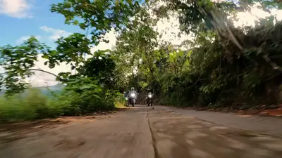 Riding a narrow road through the jungle