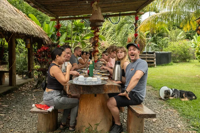 Guests eating together at the long table at Donkey Sunrise